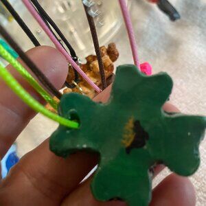 4 leaf clovers with pot of clay gold dangling earrings